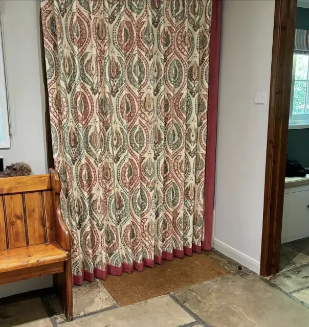 Interlined Lewis & Wood curtains in an ikat print with a contrasting leading-edge border