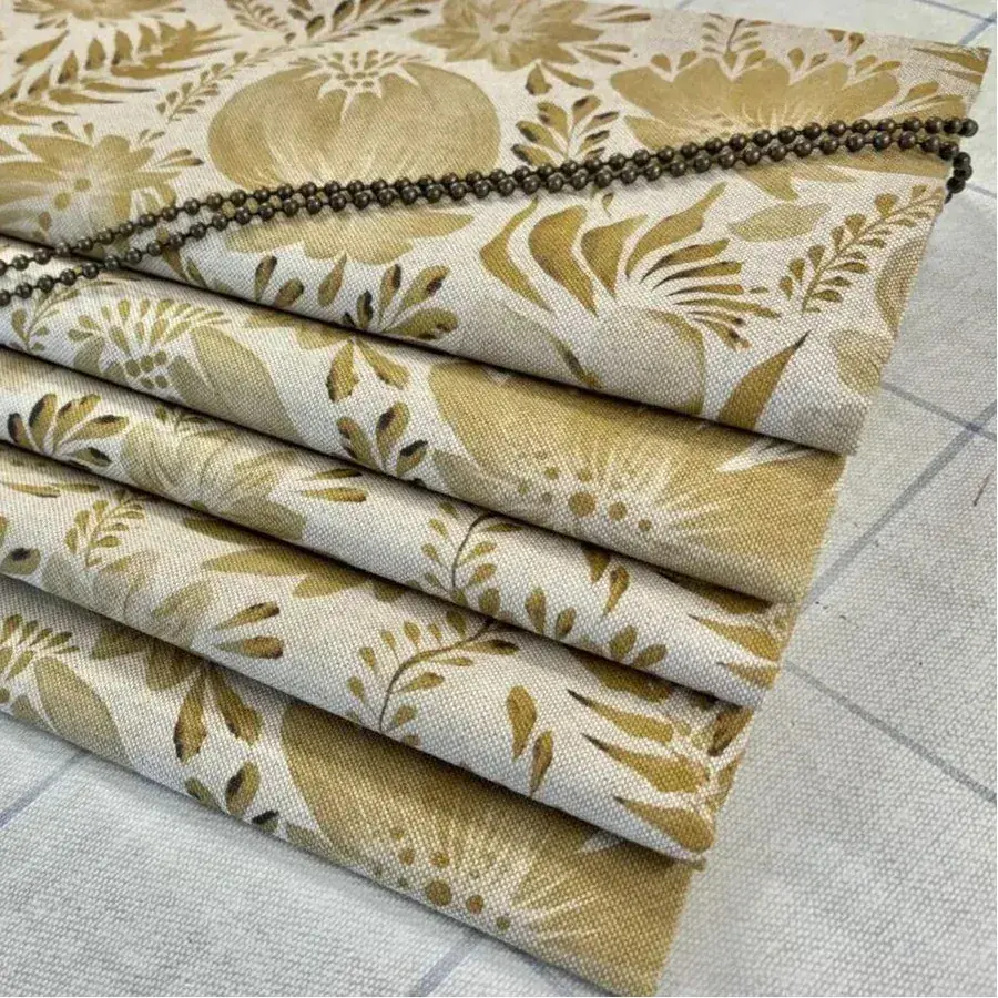 Curtains and blinds being measured and finished by hand in the workroom