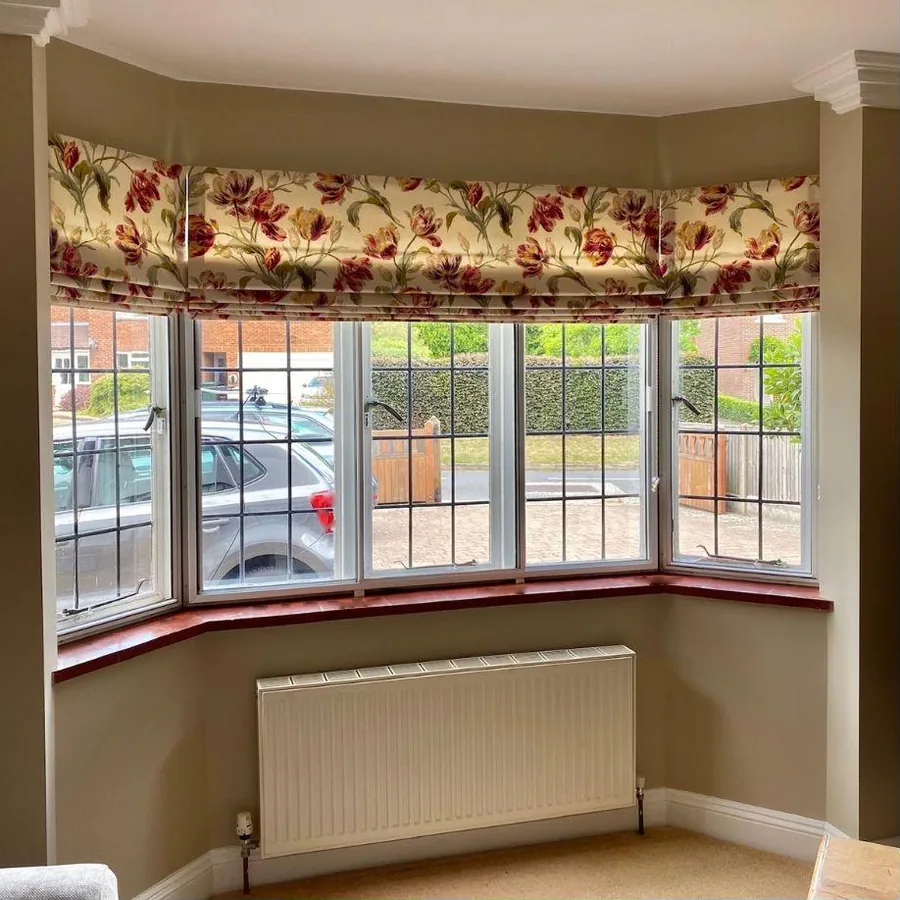 Handmade made-to-measure Roman blind in a bay window